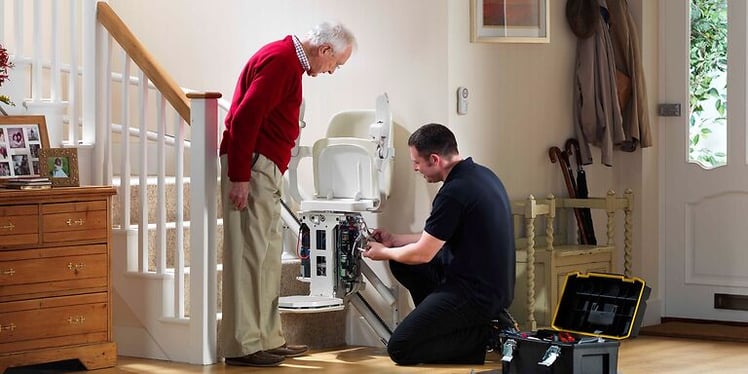 Stannah engineer servicing a stairlift 