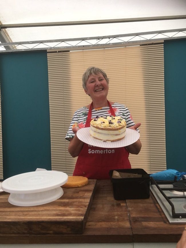 Val holding her special summer Elderflower and Lemon Cake