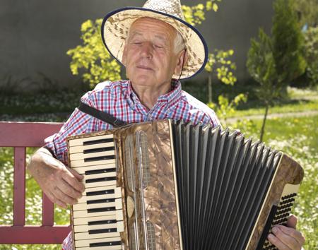 Elderly playing instrument