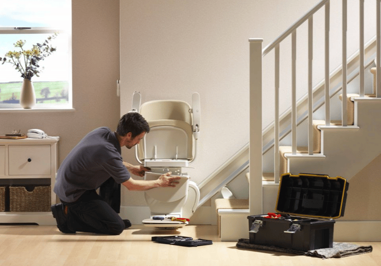 Stannah engineer installing a stairlift